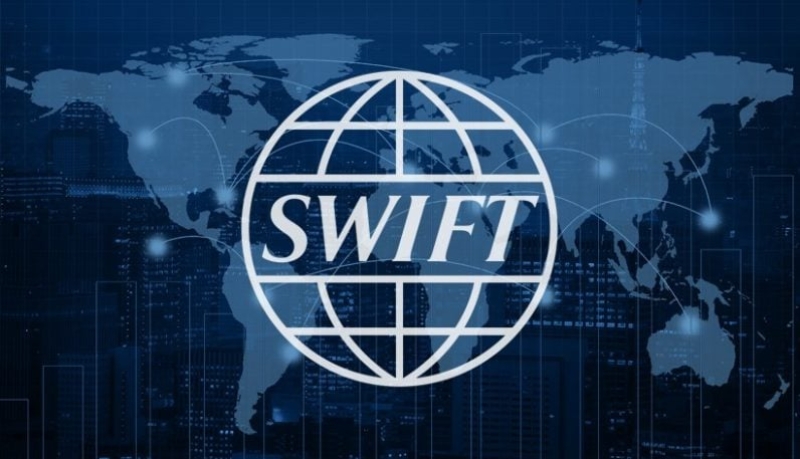 Swift to pilot digital currency deals in 2025